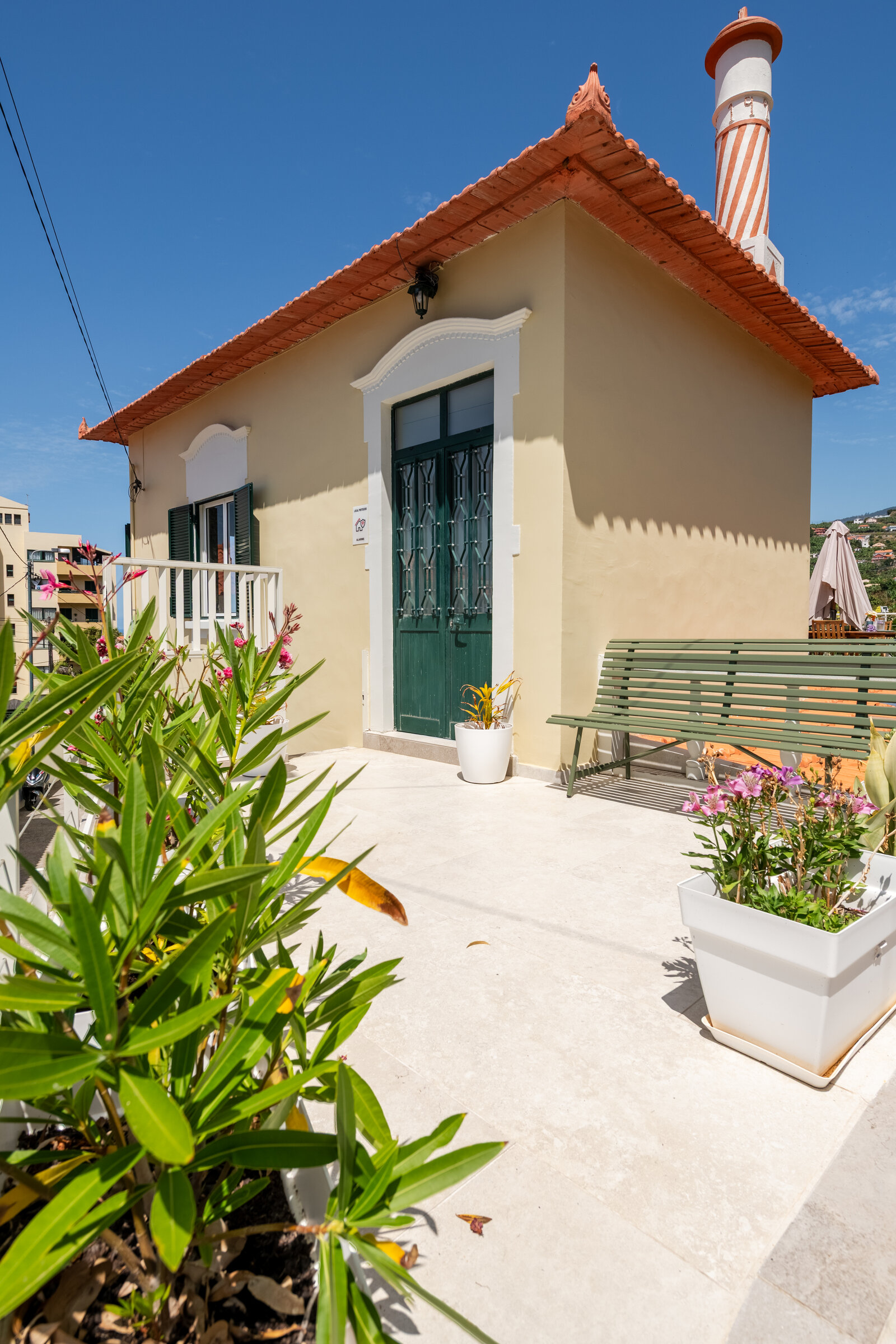 Atlantic Studio exterior, traditional Madeiran house with terracotta roof and garden entrance