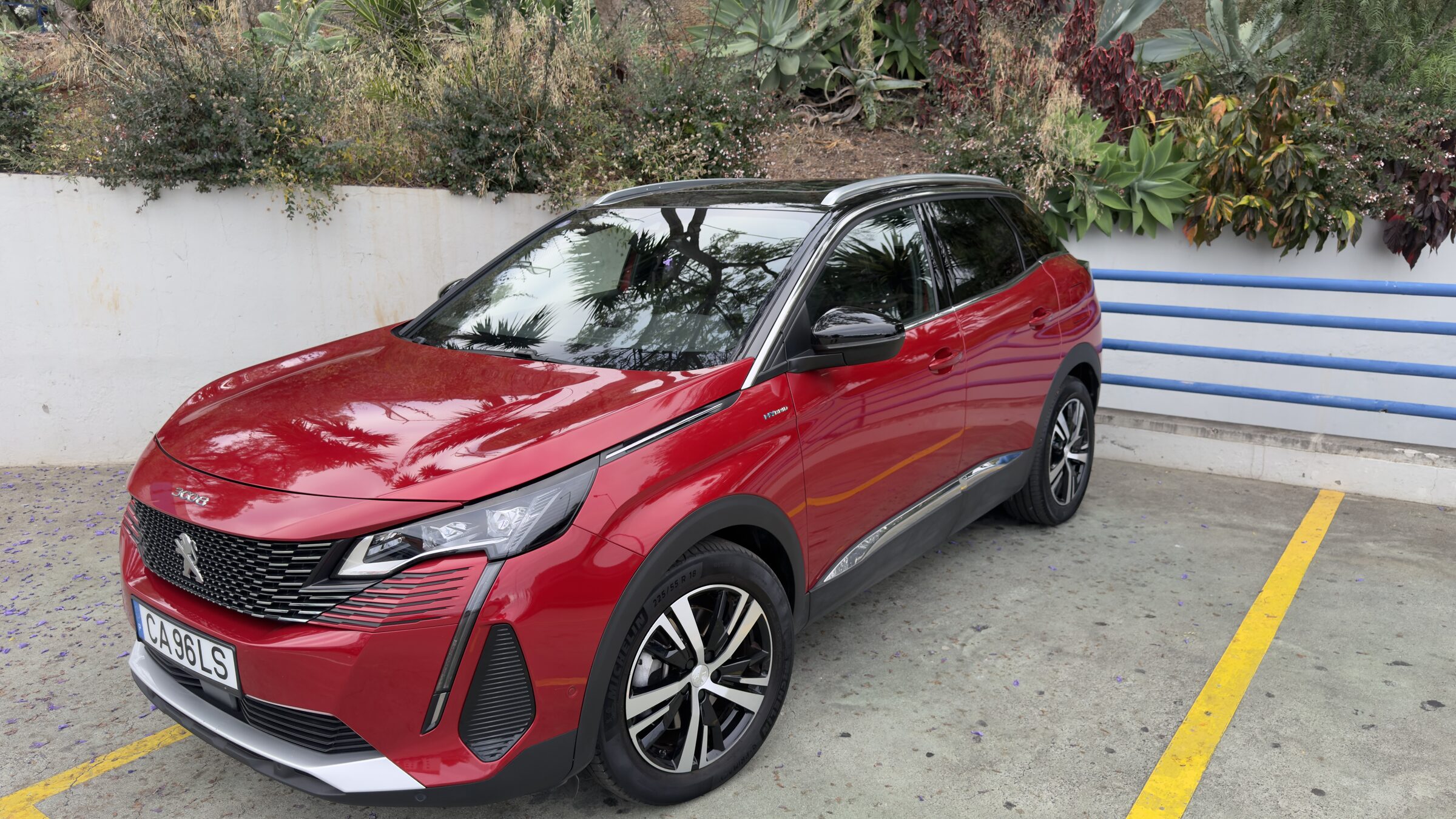 Peugeot 3008 Hybrid, three-quarter front view, red