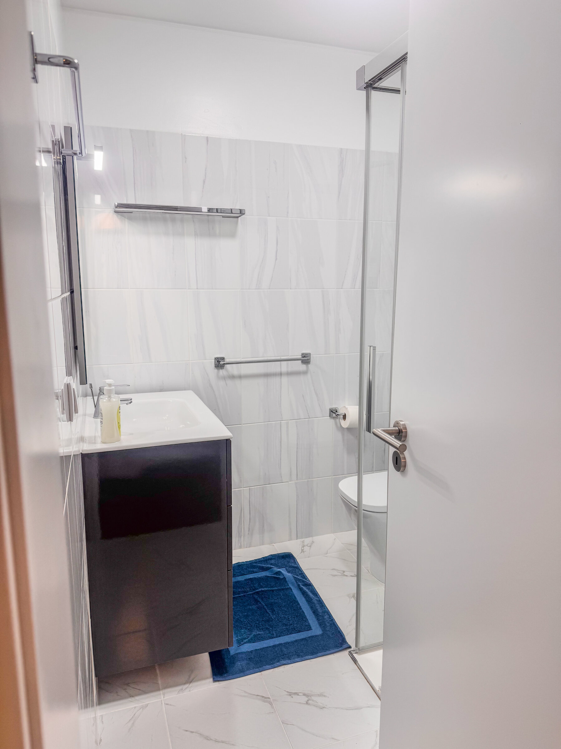 Second bathroom with vanity and glass shower