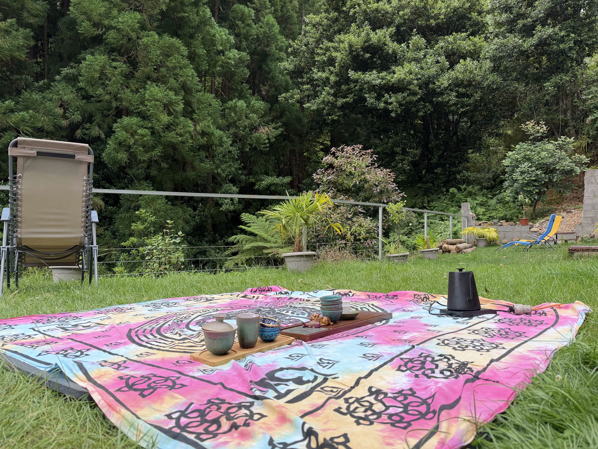 Chinese tea ceremony laid out on a blanket during the Madeira Longevity Ritual
