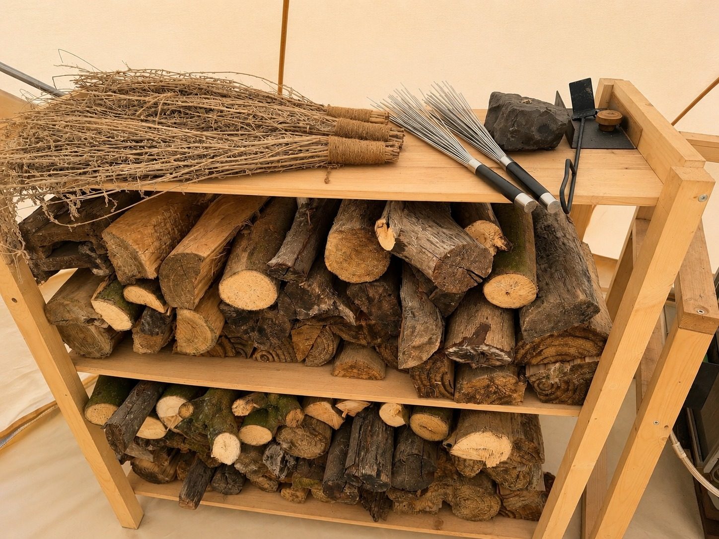 Firewood and metal venik whisks used for the sauna massage, Madeira Longevity Ritual