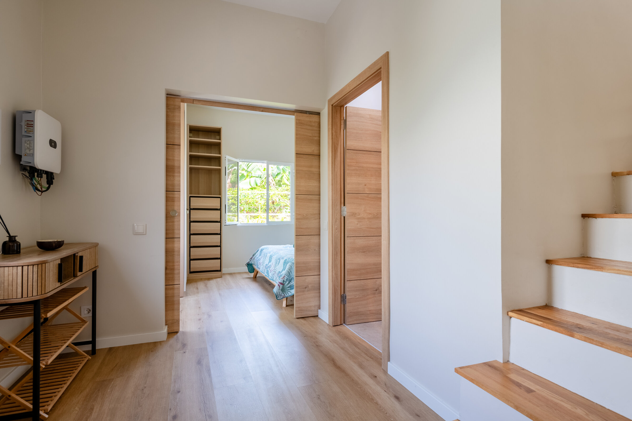 Hallway and stairs connecting the two floors of apartments