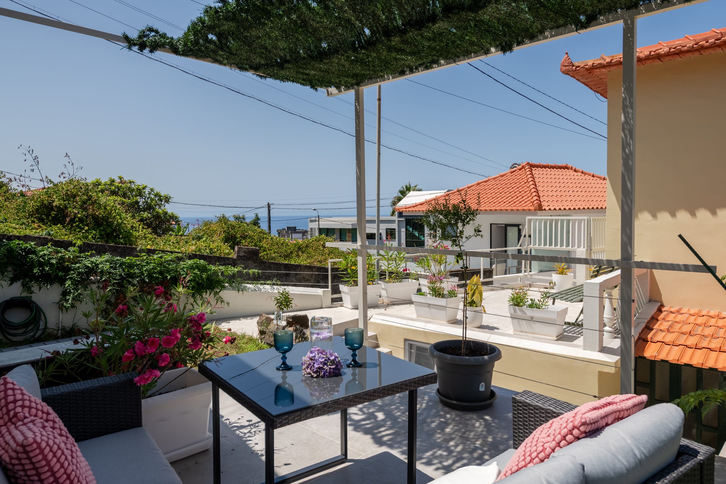 Shaded pergola seating with sea view