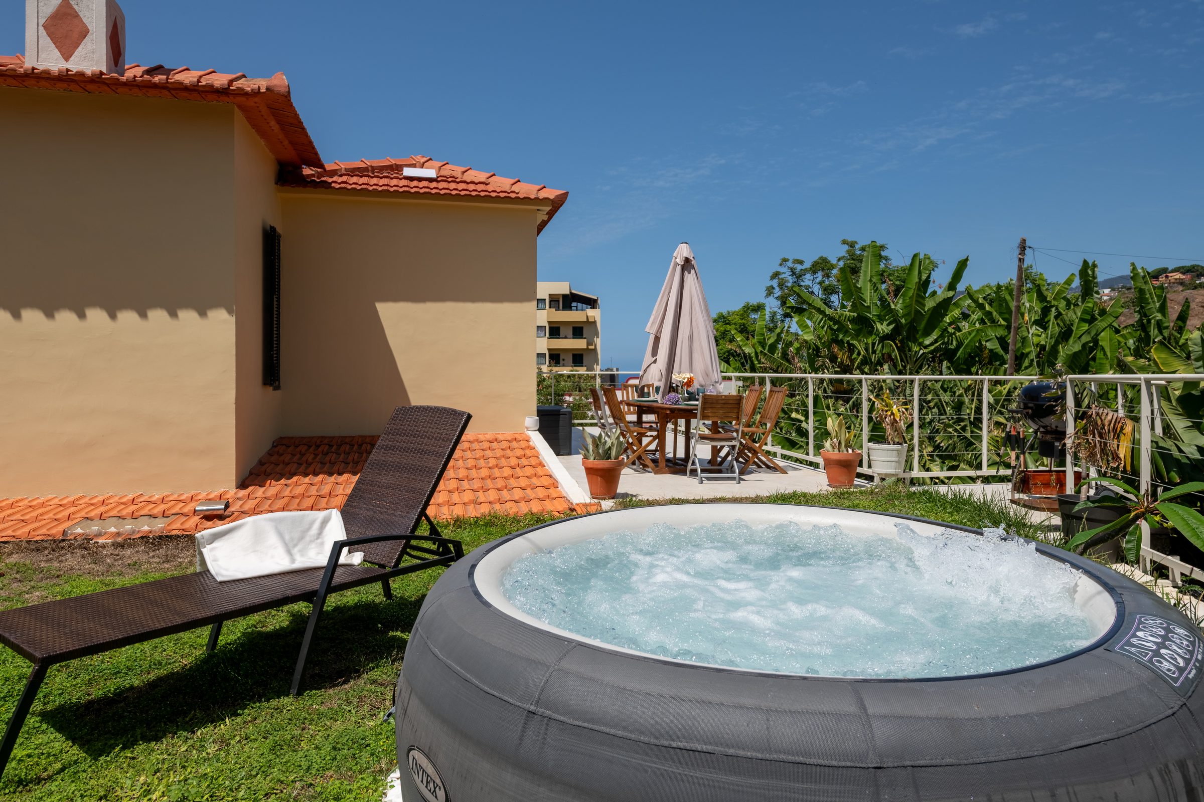 Jacuzzi terrace with outdoor dining and barbecue