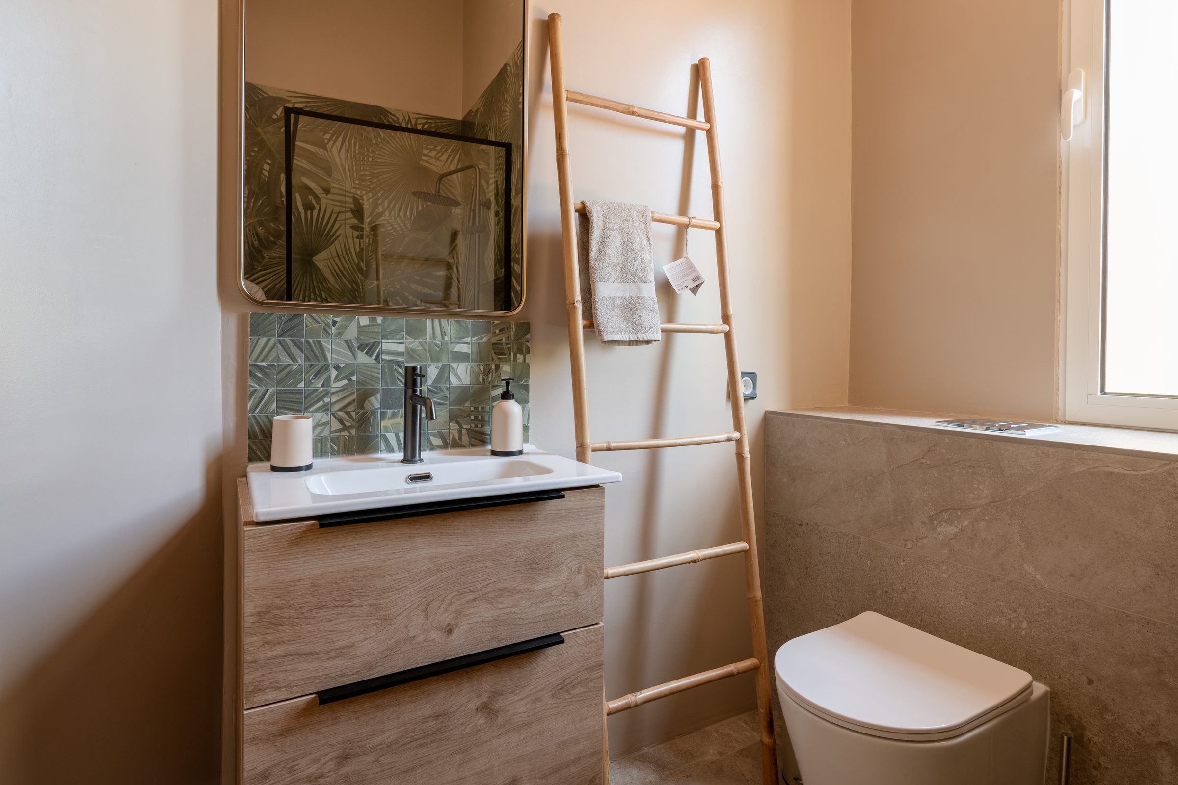 Bathroom with rainfall shower and bamboo towel ladder